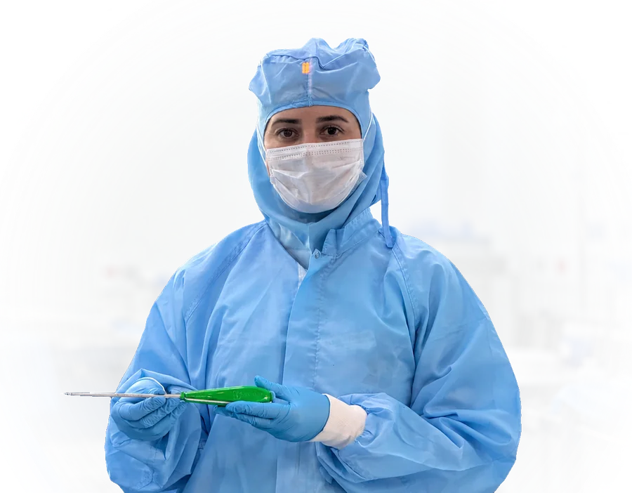 Sartori team member in the clean room holding a surgical instrument