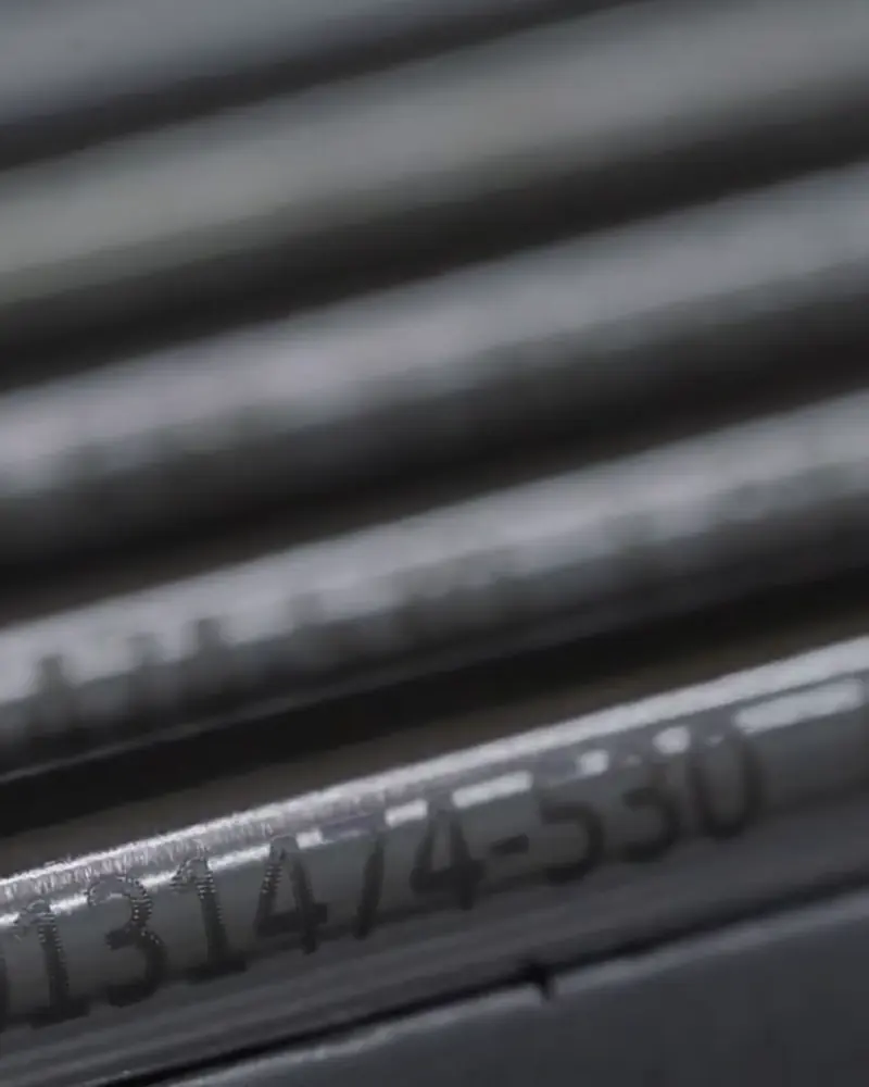 Metal rods with laser-engraved code and lot number